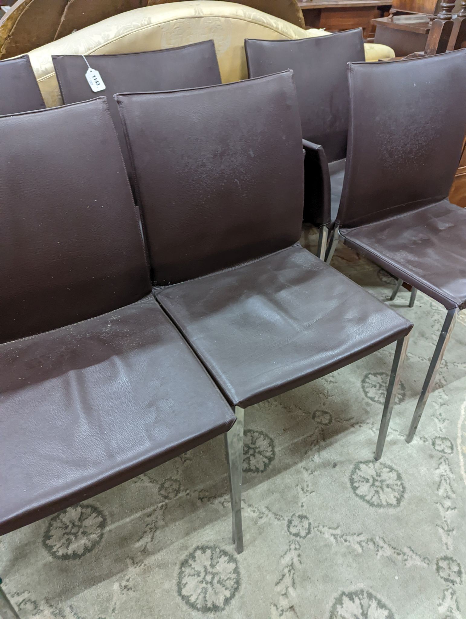 A set of six contemporary brown leather dining chairs